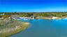 Bird's eye view of a large body of water and a tree filled landscape