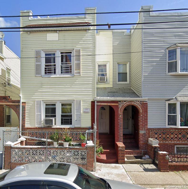 Townhome / multi-family property featuring brick siding and cooling unit