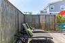 Outdoor wood deck featuring a bamboo privacy screen