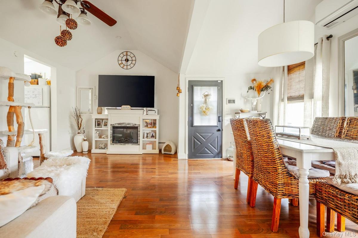 Hardwood flooring extending throughout the space