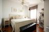 Bedroom featuring rich wood-finish flooring and a ceiling fan
