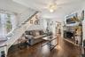 cottage living room with stair to loft bedroom