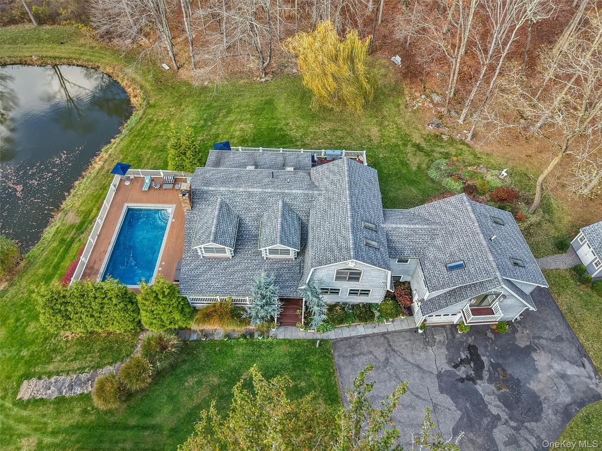 Main house, pond, pool,  and garage