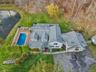 Main house, pond, pool,  and garage