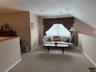 The other half of the loft area, perfect for the quiet book, or an extra bedroom tucked away