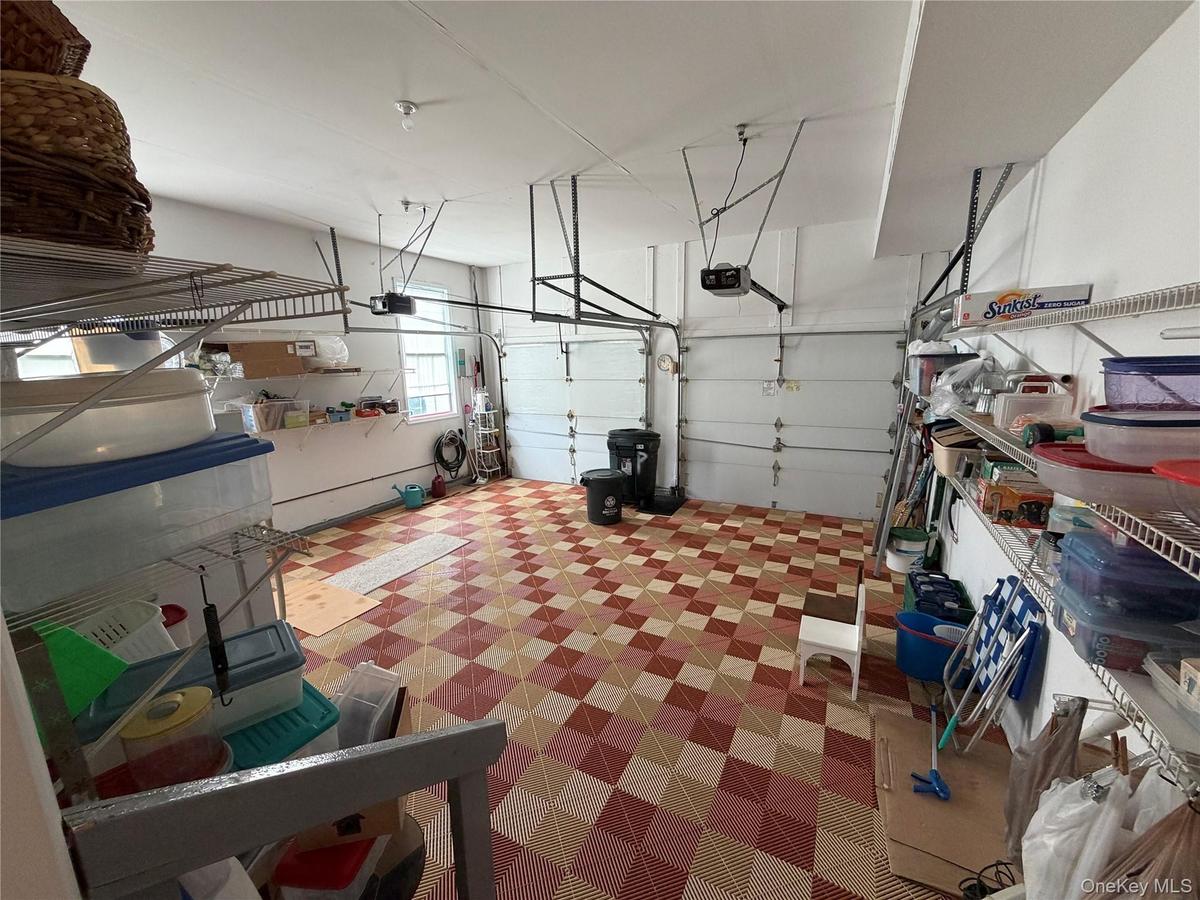 large 2 car garage, with plenty of overhead room, and storage