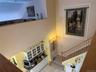 looking down to the kitchen from upstairs,