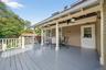Deck featuring outdoor dining area, a ceiling fan, and grilling area