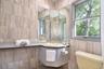 Full bath with tile walls and vanity