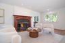 Sitting room featuring a premium fireplace, wood finished floors, and recessed lighting