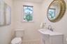 Half bath featuring healthy amount of natural light and vanity