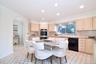 Kitchen with light stone countertops, dishwasher, tasteful backsplash, stainless steel double oven, and recessed lighting