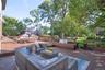 Wooden deck featuring an outdoor living space and view of wooded area