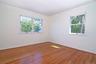Empty room featuring wood finished floors and baseboards