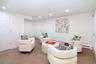 Bedroom featuring carpet floors, recessed lighting, and a baseboard heating unit