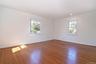 Empty room featuring wood finished floors and recessed lighting