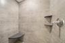 Bathroom featuring tiled shower