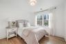 Bedroom with light hardwood / wood-style floors