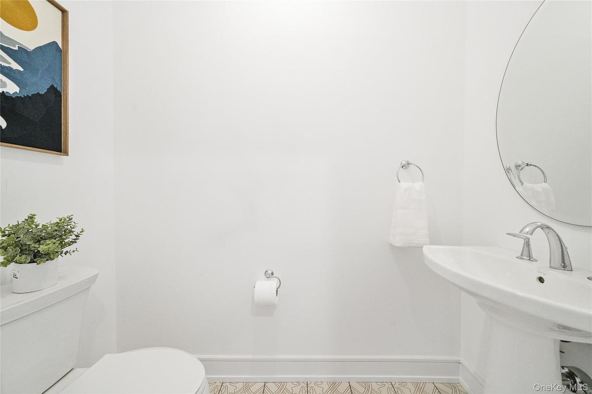 Bathroom featuring sink and toilet