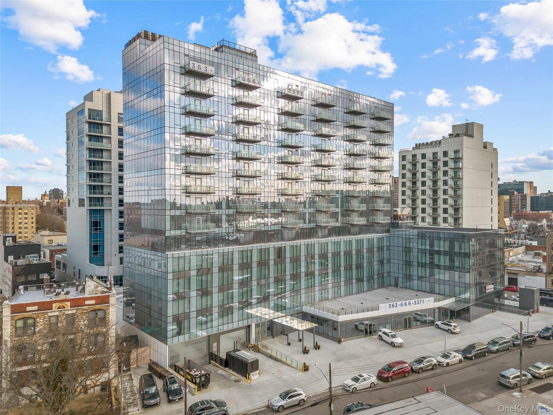 View of apartment building / complex with a city view