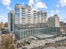 View of apartment building / complex with a city view