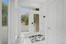 Bright entryway featuring a full-light glass entry door, side windows, transom window, and tiled flooring