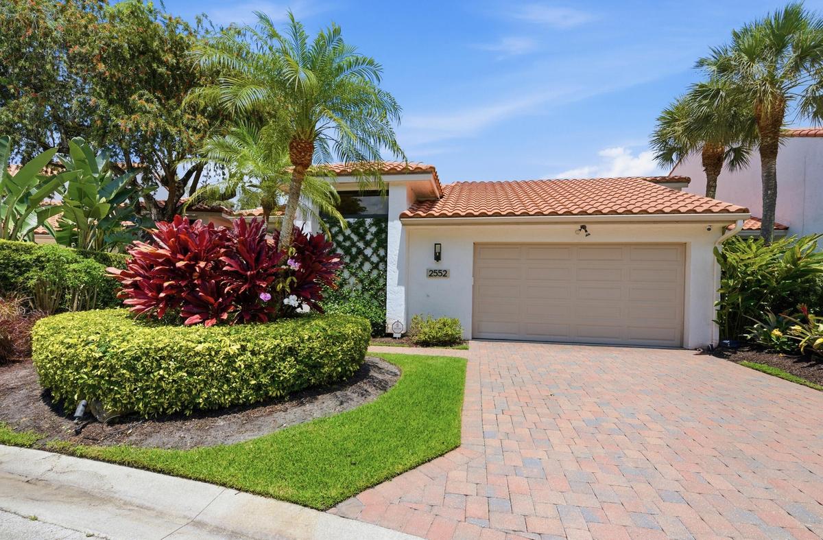 Front exterior of 2552 Sheltingham Drive in Palm Beach Polo, Wellington FL luxury rental home