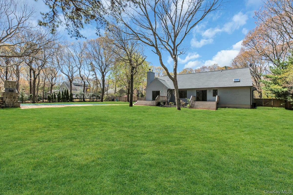 Shy acre green lawn with mature trees