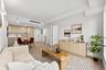 Living room with recessed lighting and light wood-style flooring