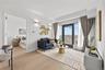 Sitting room featuring light wood-style flooring and baseboards