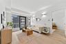 Living room with light wood-style floors and baseboards