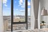 Bedroom featuring a view of skyline