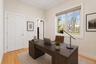 Bedroom virtually staged as office.