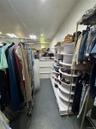Walk in closet with a drop ceiling