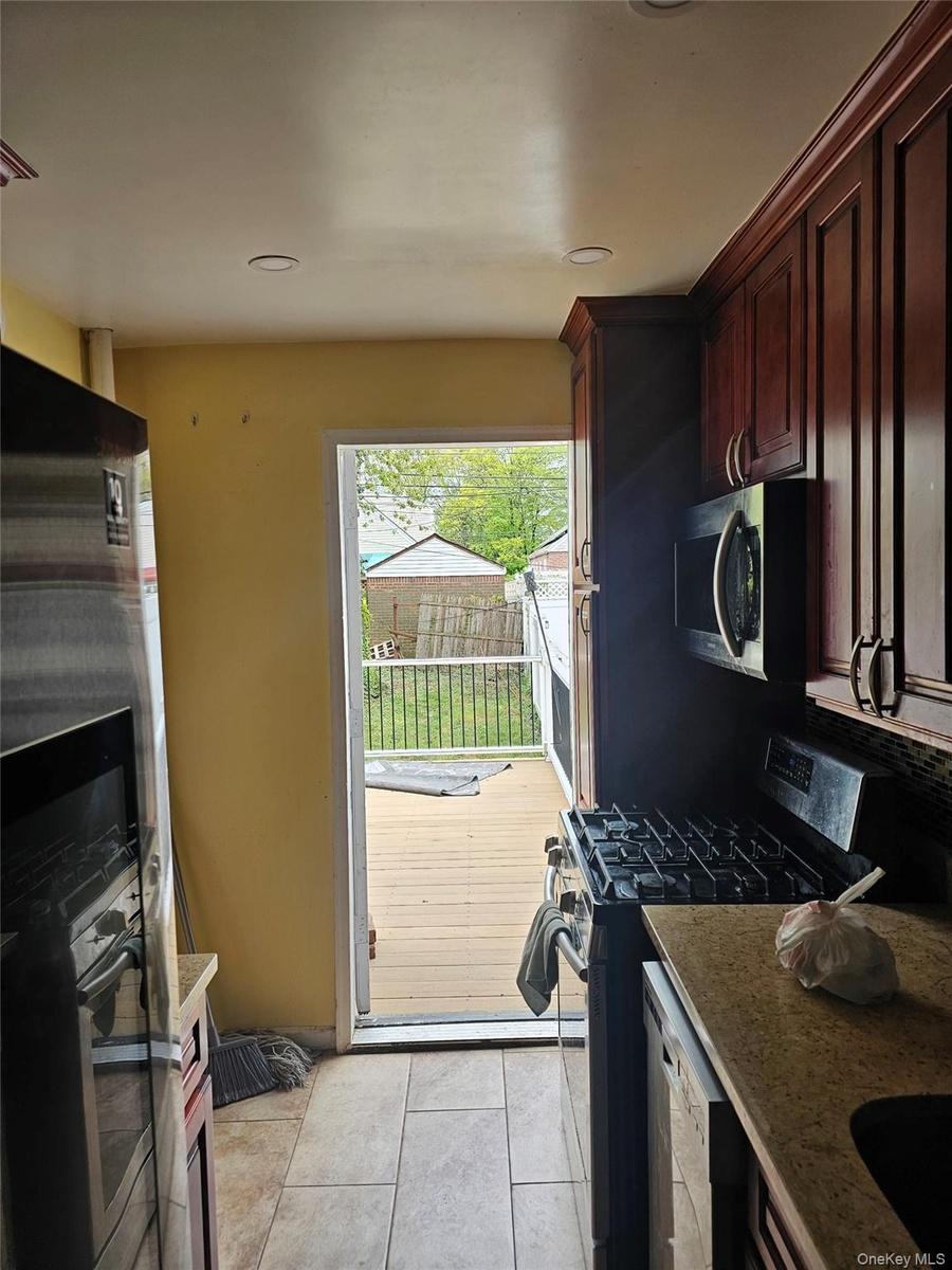 Rear door to Deck & backyard from kitchen
