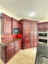 subzero refrigerator double paneled doors and double wolf ovens