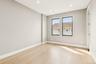 Empty room with light wood-type flooring and recessed lighting