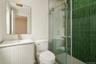 Bathroom featuring a stall shower and vanity