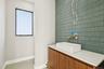 Bathroom featuring baseboards and vanity