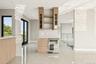 Kitchen featuring wine cooler, open shelves, light brown cabinetry, modern cabinets, and light tile patterned floors