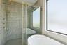 Full bath with a soaking tub and a stall shower