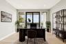 Office area with light wood finished floors and recessed lighting
