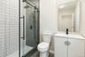Full bath featuring vanity and a stall shower