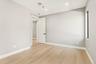 Empty room featuring light wood-style flooring and recessed lighting