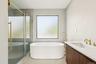 Full bathroom with vanity, a soaking tub, a shower stall, and light tile patterned flooring