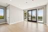 Spare room featuring light wood-style floors, healthy amount of natural light, and recessed lighting