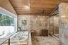 large primary bathroom with steam shower