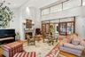 high vaulted ceilings with wood burning fireplace and wall to wall windows