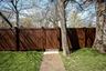 The property features a gate with direct access to the Old Croton Aqueduct Trail, providing a convenient pedestrian connection into the Village of Irv