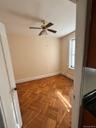 Unfurnished room with baseboards and a ceiling fan